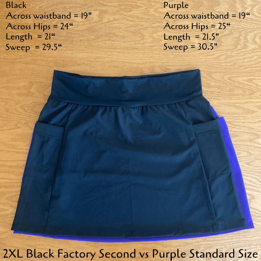 Blue skirt with purple lining on a wooden surface, showing measurements.