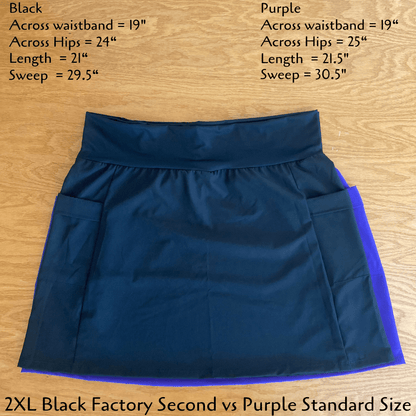 Blue skirt with purple lining on a wooden surface, showing measurements.