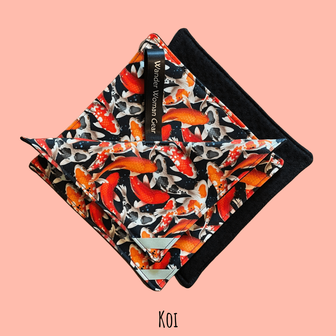 Koi fish patterned pouch with black border on a pink background