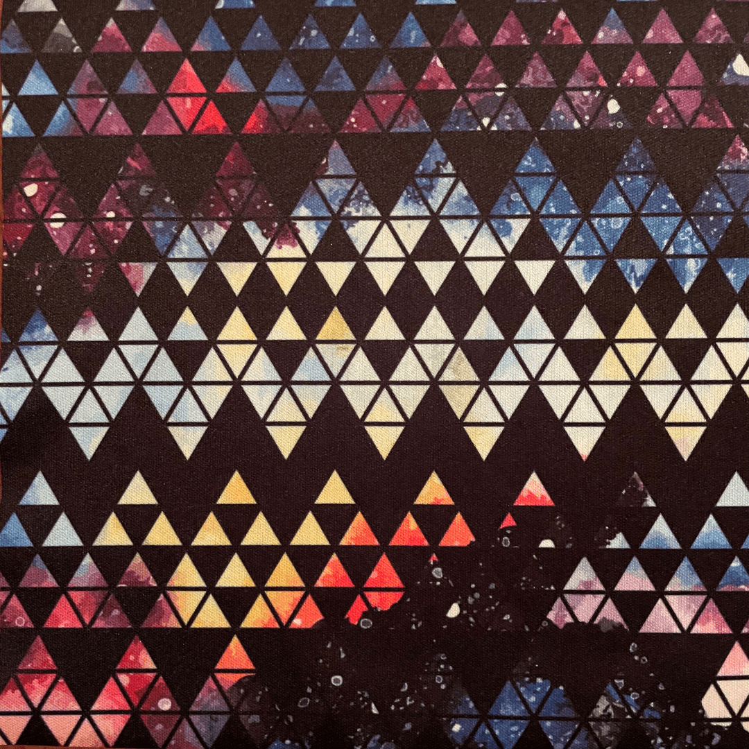 Geometric pattern with triangles in various colors on a black background
