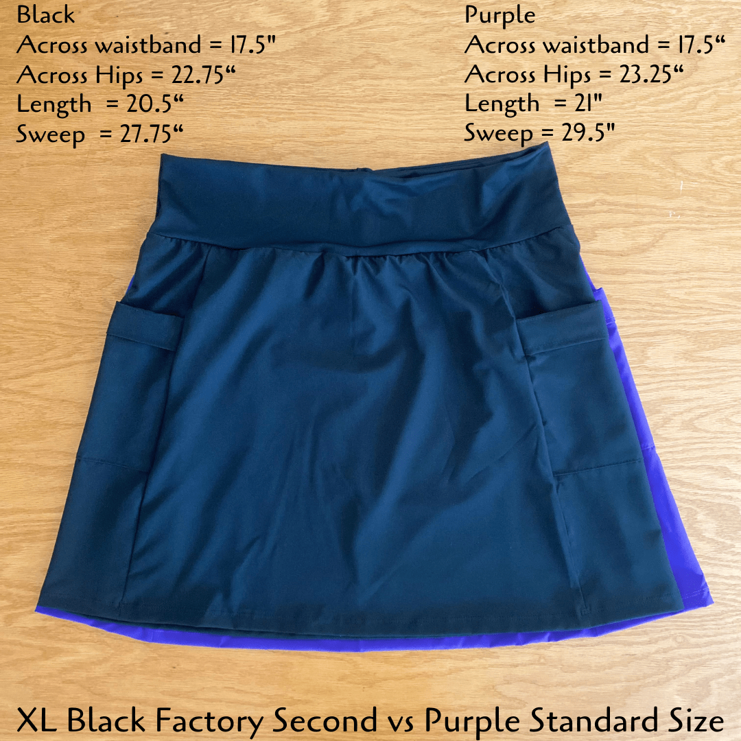 Blue and purple skirt on a wooden surface with measurements displayed.